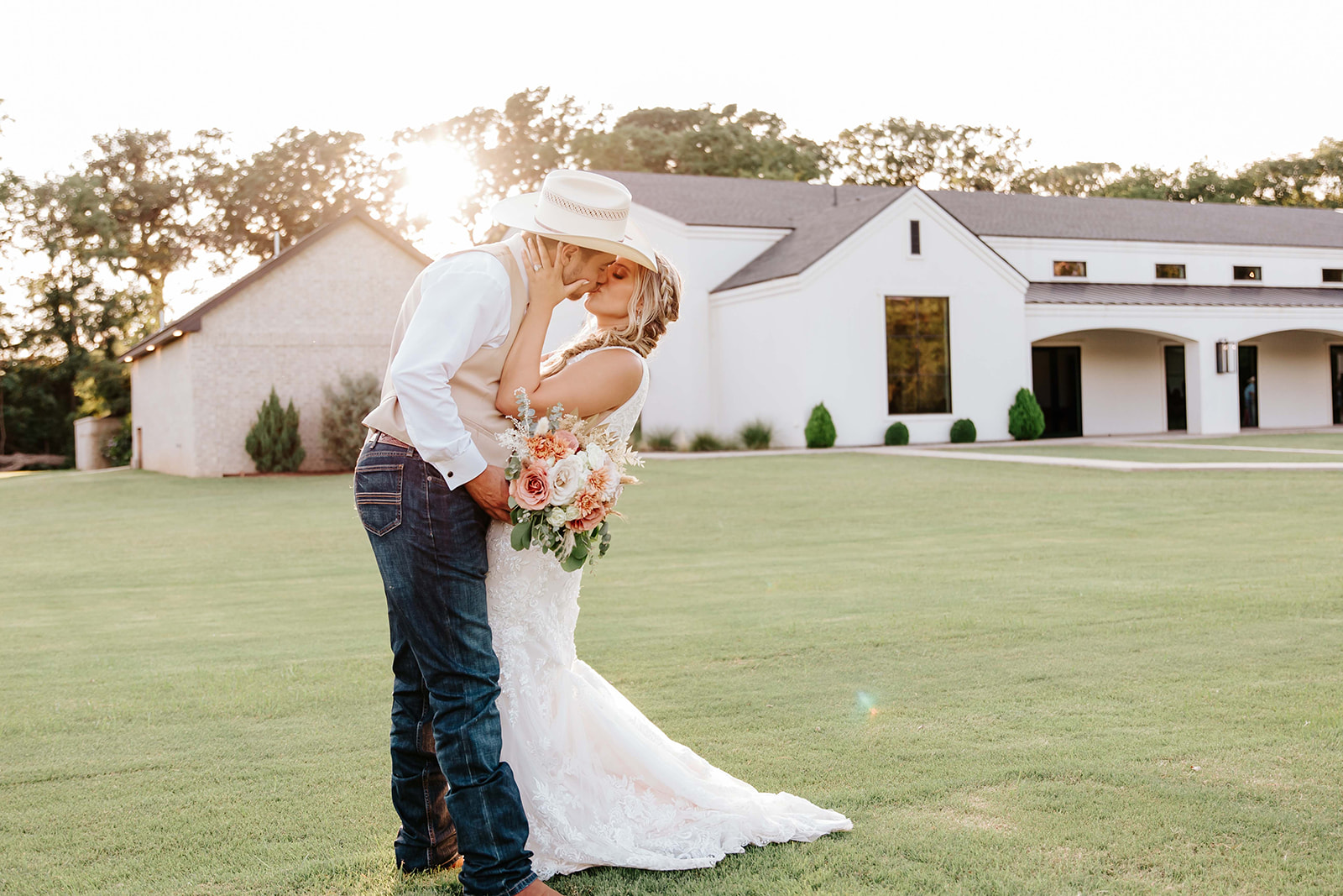 Best Oklahoma Wedding Photographer -Bridget Blood Photo, wedding couple photography, estate wedding in Oklahoma, wedding venue Oklahoma, gorgeous view of this wedding estate in Oklahoma with the wedding couple kissing during wedding photography.