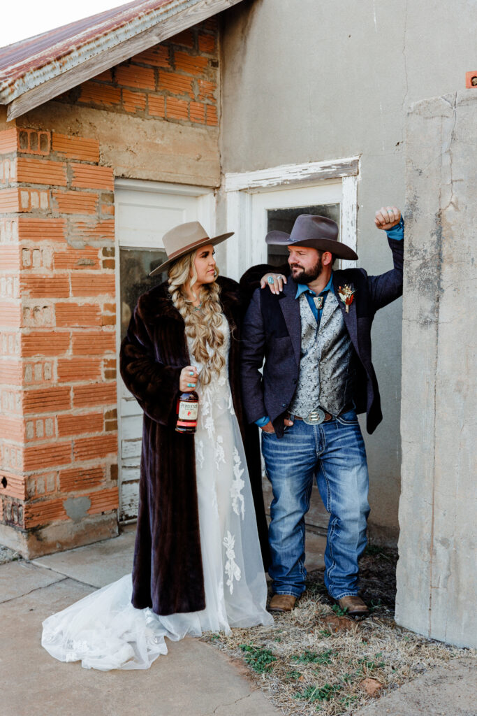 bride with fur coat and groom with western style