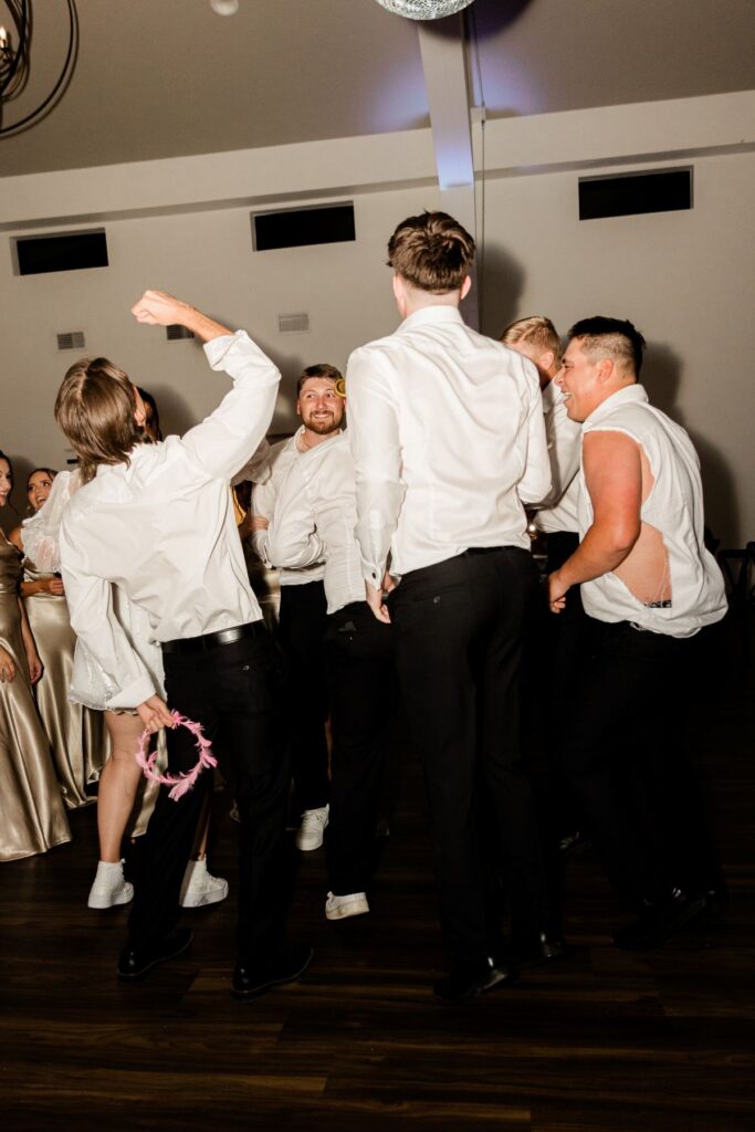wedding reception groomsmen dancing