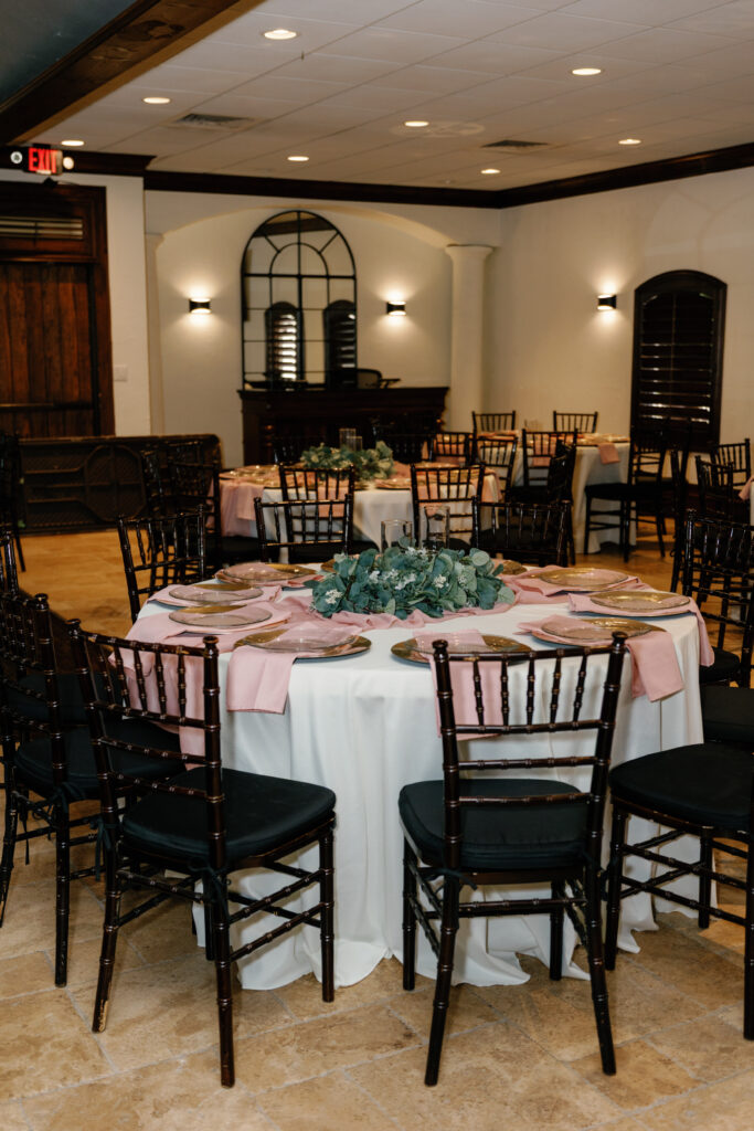 Elegant reception table setup with blush details and greenery at Rose Briar Place in OKC
