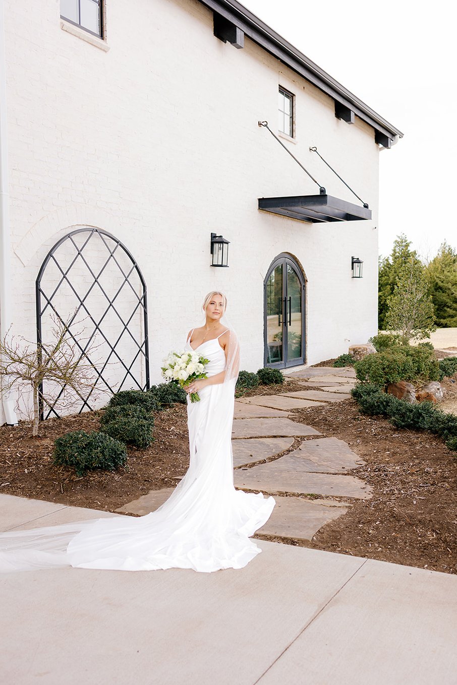 A bride posing for a picture at the range on the Wedding venues in OKC