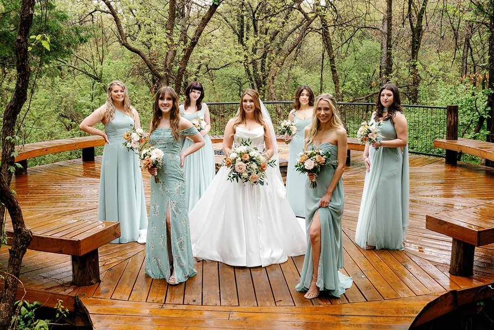 a beautiful bridal party posing for a picture at the merrick hollow wedding in OKC