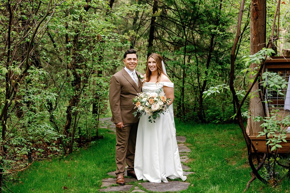the bride and groom at merrick hollow an oklahoma city wedding venue posing for a picture