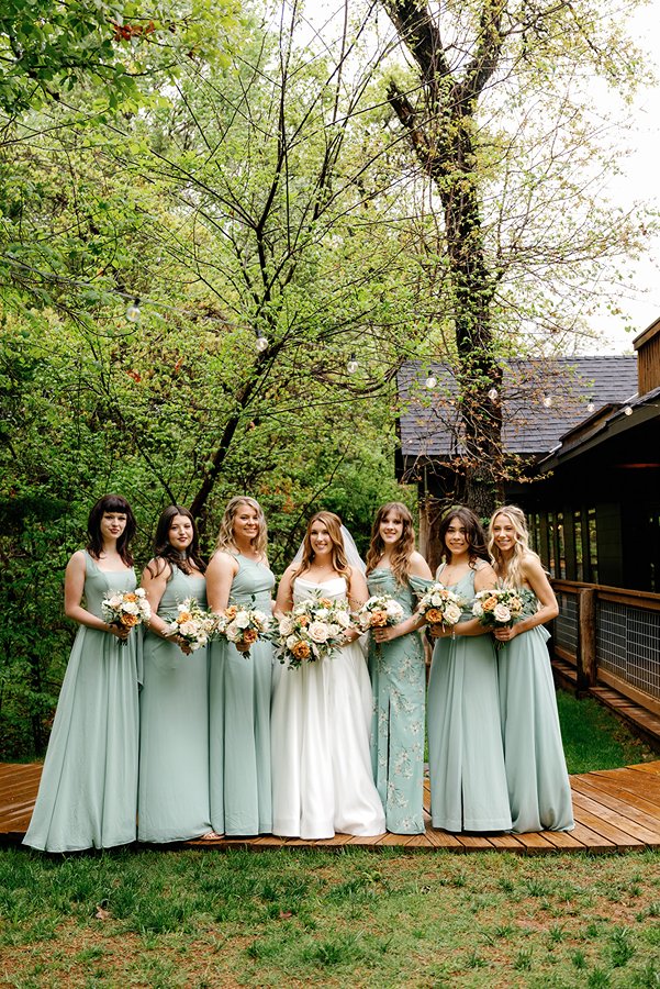 bridesmaids dressed in a beautiful blue that accentuates the fairy feel of merrick hollow