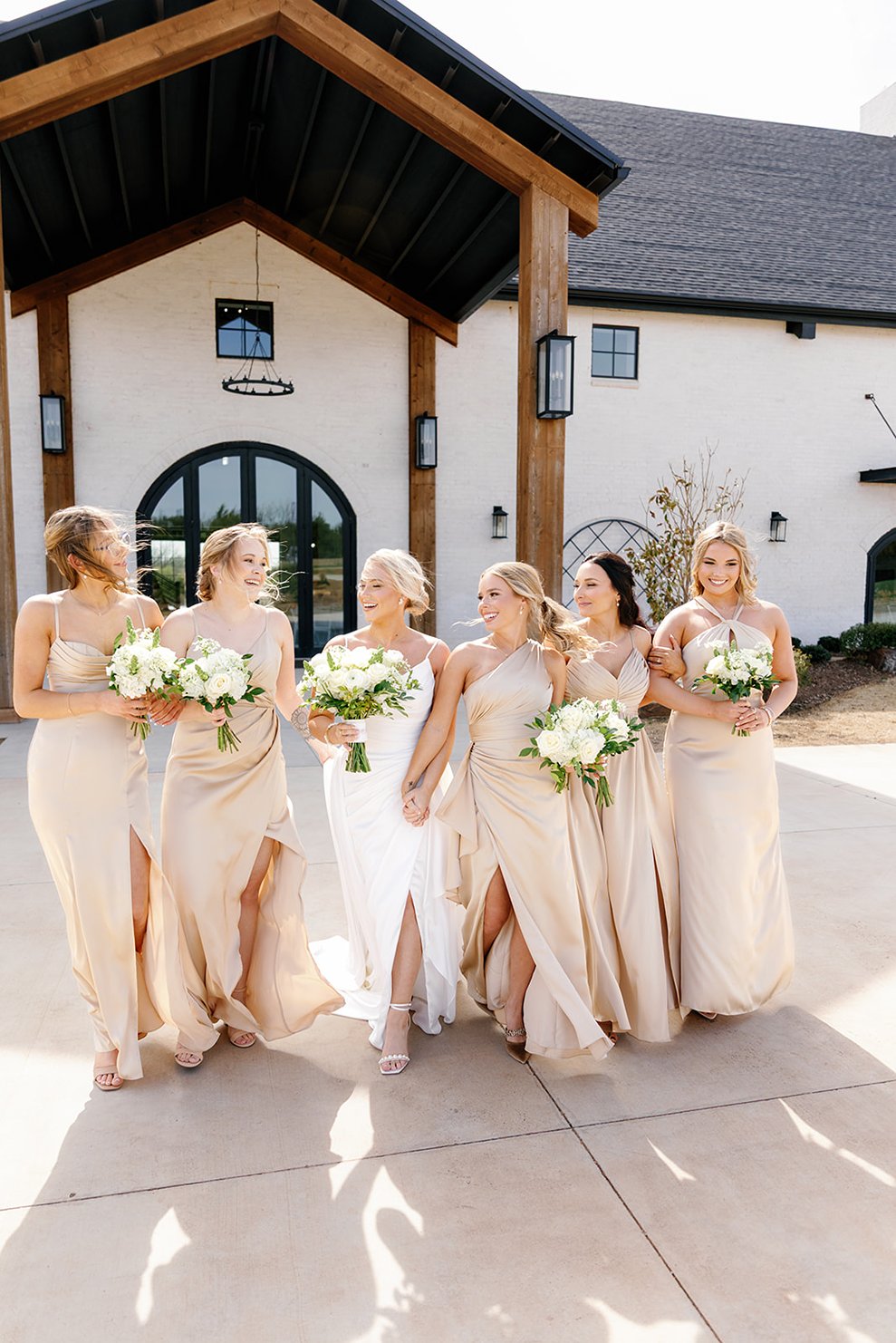 a bride and her bridal party outside of the range one of the wedding venues in OKC