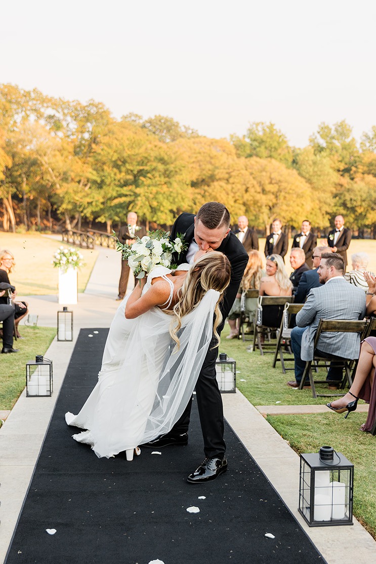 a bride and groom at their wedding ceremony planned by sweet moments by dalana a wedding planner in okc
