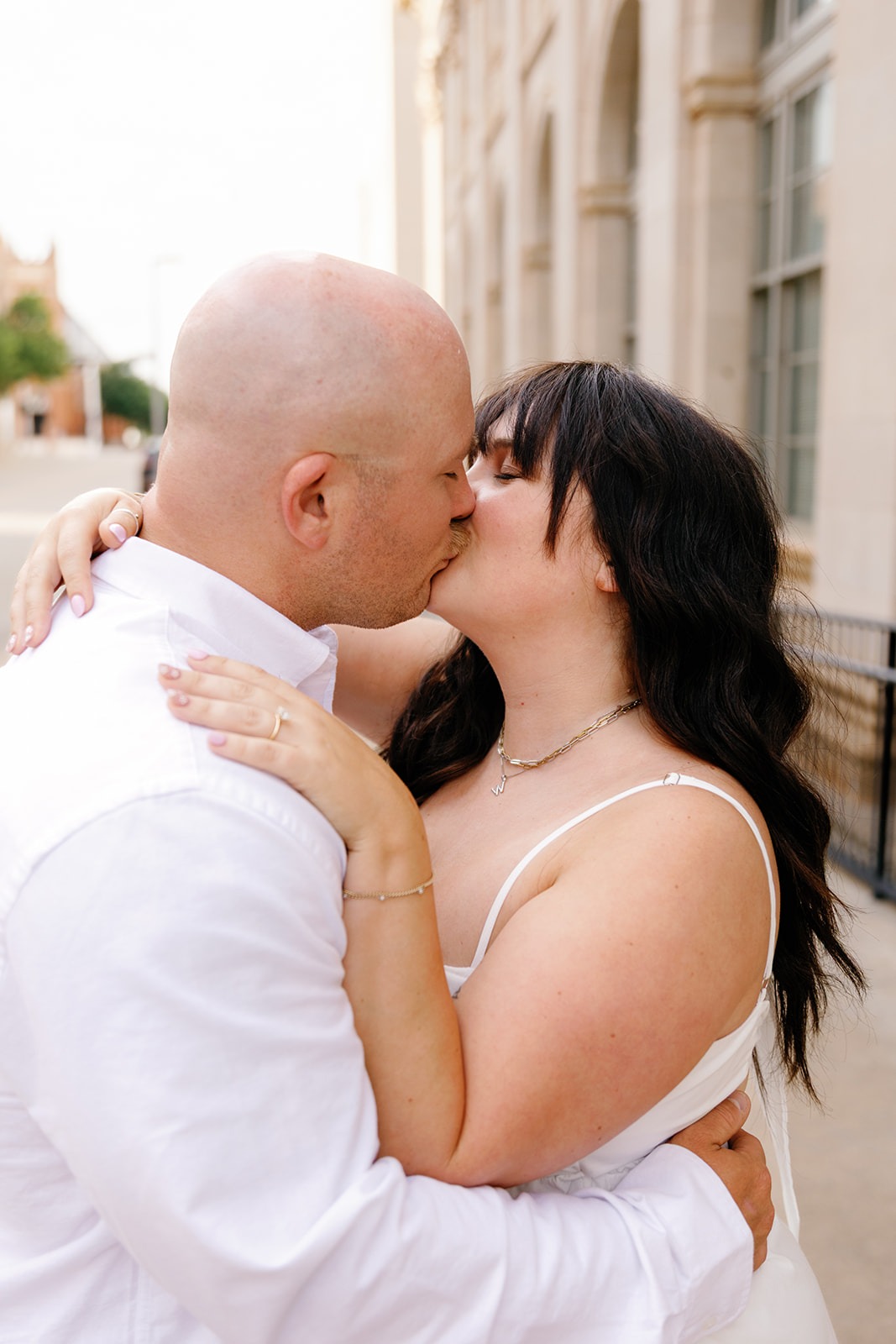 OKC wedding photographers capture couple at sunset during engagement session