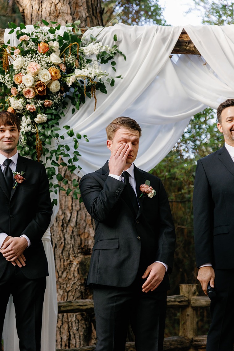 a groom shedding tears for his beautiful bride who found her dress at a wedding dress shop in okc